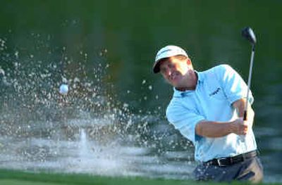 
Fred Funk blasts out of a trap to the 18th green Monday en route to victory in The Players Championship in Ponte Vedra Beach, Fla. 
 (Associated Press / The Spokesman-Review)