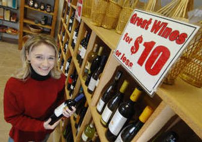 The Wine Rack owner Jocelyn Vorbach shows one of her top $10 bottles of wine last week in Morgantown, W.Va. Associated Press
(Associated Press / The Spokesman-Review)