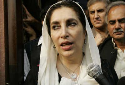 
Opposition leader Benazir Bhutto  visits a shrine Monday in Lahore, Pakistan. Associated Press
 (Associated Press / The Spokesman-Review)