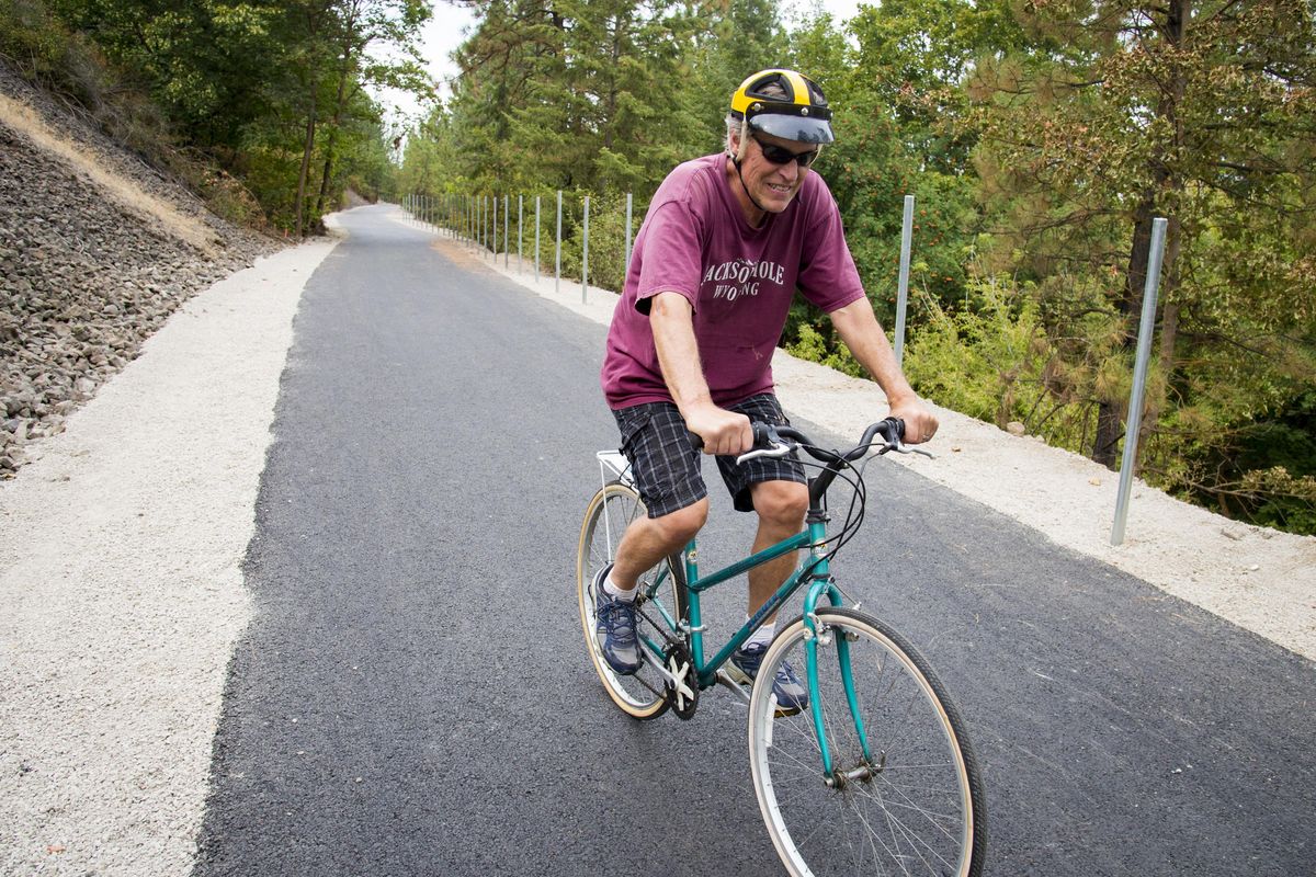 “It’s pretty impressive,” Howard Zickler said as he rides the newly widened and paved Ben Burr Trail between Liberty and Underhill parks Tuesday, Aug 30, 2016. The project has been controversial, and is still getting mixed reviews now that the wider, smooth pathway has nearly been completed. (Colin Mulvany / The Spokesman-Review)