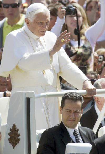 In this Wednesday photo, Pope Benedict XVI delivers his blessing as he arrives at St.Peter's square at the Vatican for a general audience. The Vatican confirmed today that the pope's butler Paolo Gabriele, bottom, was arrested in an embarrassing leaks scandal. Gabriele was arrested in his home inside Vatican City with secret documents in his possession. (AP/Andrew Medichini)