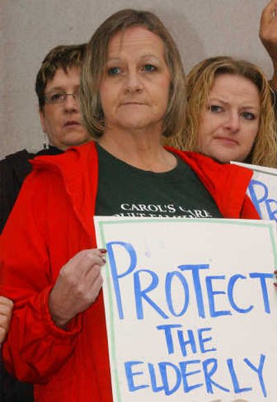 
Carol Carroll, owner of an adult family home in Spokane, protests Tuesday in Olympia. 
 (RICHARD ROESLER / The Spokesman-Review)