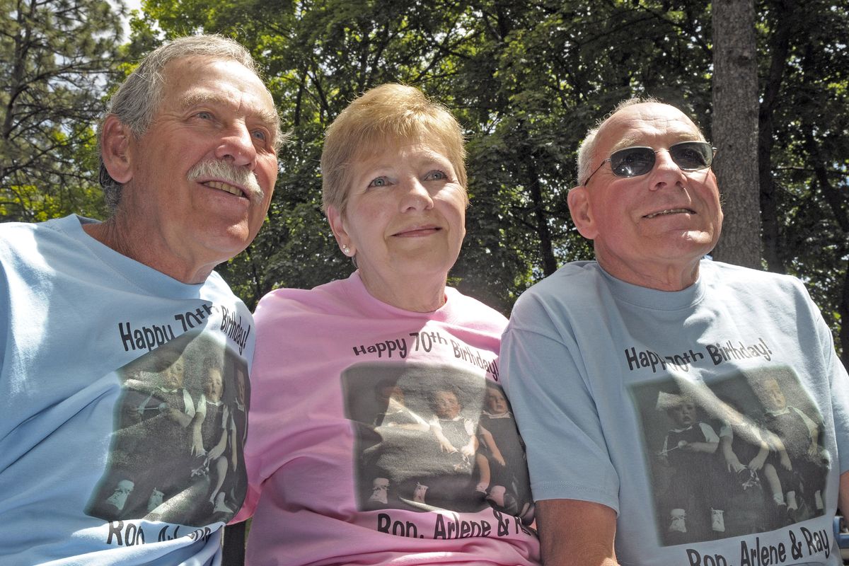 The triplets born at Sacred Heart Hospital 70 years ago held a birthday picnic at Sutton Park in Cheney on Saturday. From left are Ron Schmitt, Arlene Mowatt and Ray Schmitt. (Christopher Anderson)