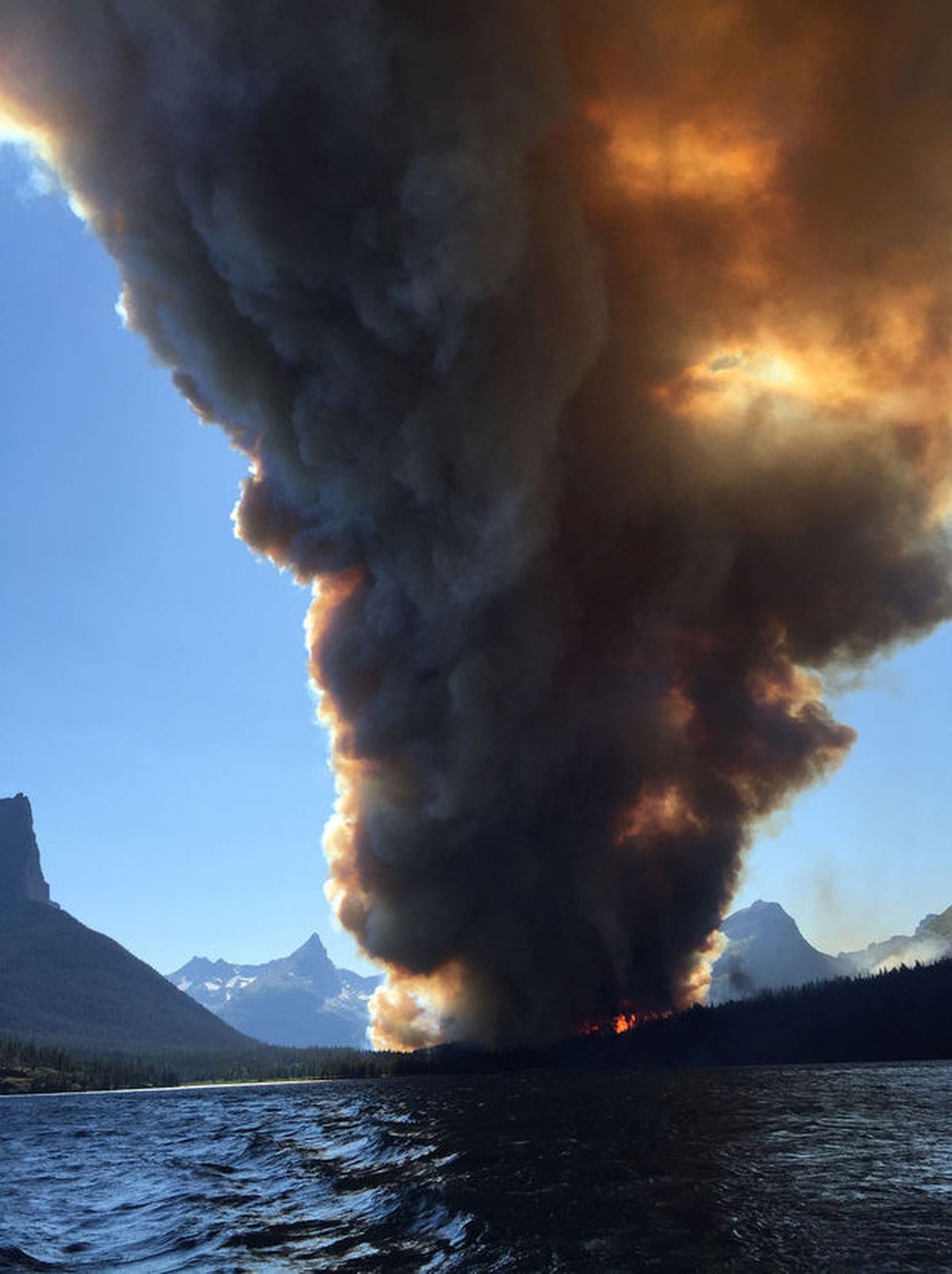 The Reynolds Creek fire is seen Wednesday from St. Mary Lake.