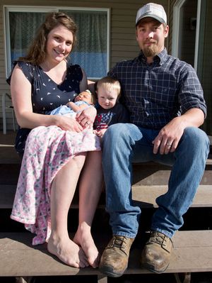 The Underdahl family poses for a portrait on Tuesday in the backyard of their Post Falls home. Pictured from left to right: Ashton, Aurelia, Archer and Scott. Aurelia is the first girl to be born to the Underdahl lineage in 101 years. (Jake Parrish/Coeur d'Alene Press photo)