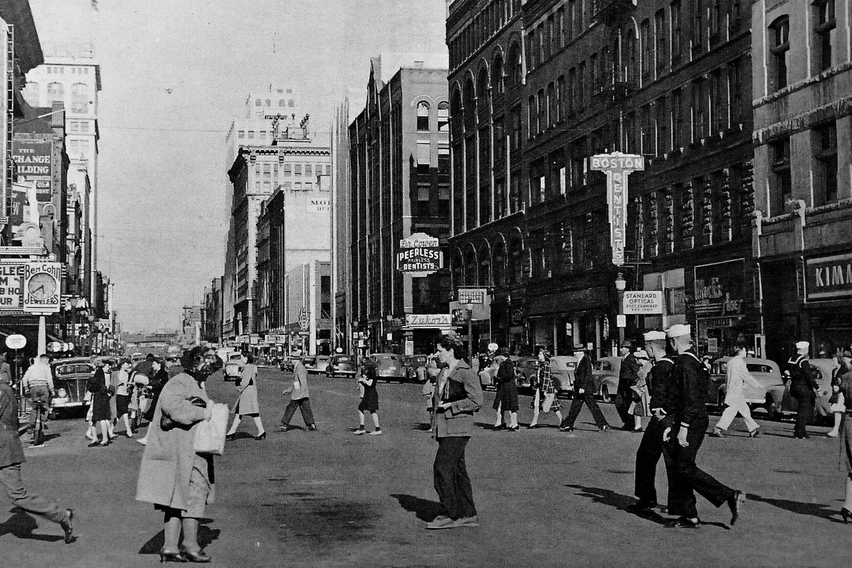 1940s: The view looking east from Post Street shows a busy West Riverside Avenue.