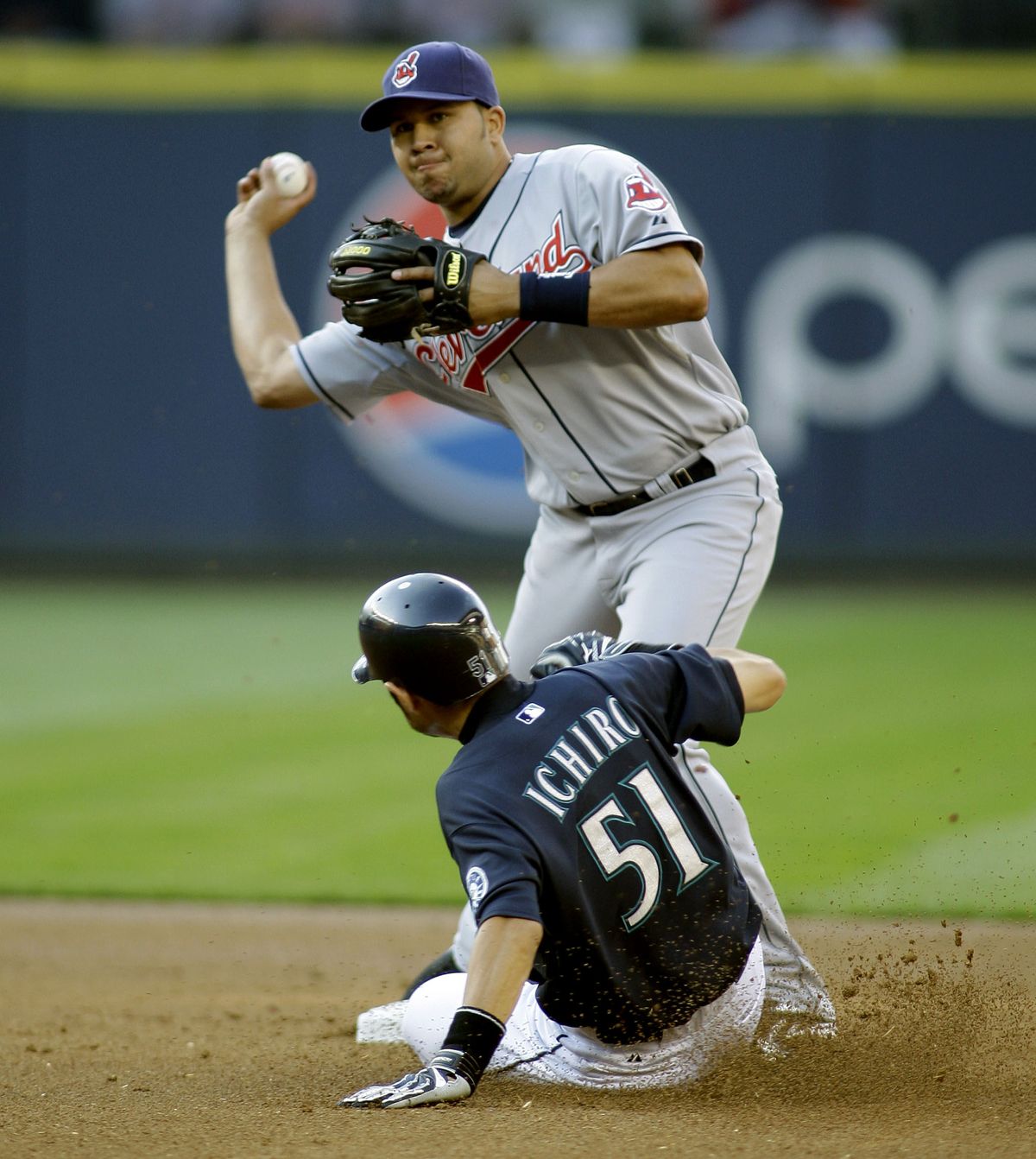 Mariners’ Ichiro Suzuki is forced at second as  Cleveland’s Jhonny Peralta turns first-inning double play.  (Associated Press / The Spokesman-Review)