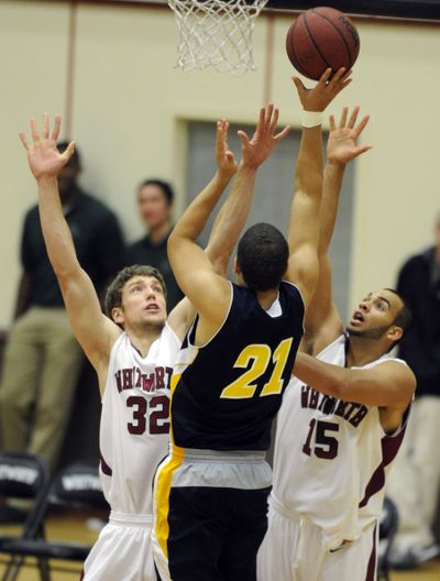 Whitworth’s Michael Taylor, left, and Zach Payne double up on UC Santa Cruz’s James Townsend. (Colin Mulvany)