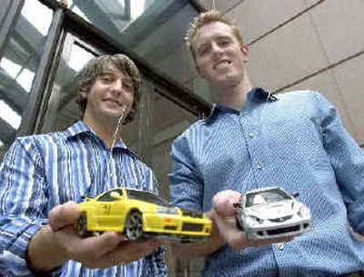 
Brian Shields, right, and his roommate Jarrett Woods show off their mini racers.
 (Associated Press / The Spokesman-Review)
