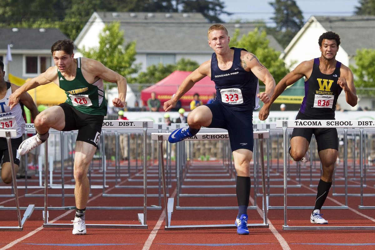 PATRICK HAGERTY
PATRICK HAGERTY
Gonzaga Prep’s Nick Johnson, center, speeds to victory in the State 4A 110-meter hurdles in a time of 14.05 seconds. (PATRICK HAGERTY / Special to The Spokesman-Review)