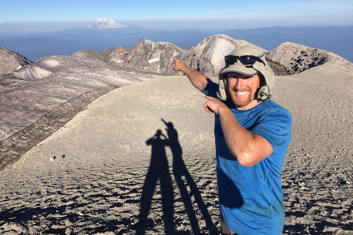 Nick Burson points to Mount Adams – which he