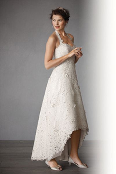 On trend: Short-in-front, long-in-back gowns, like this ivory organza gown with organza silk embroidery and curved hem BHLDN