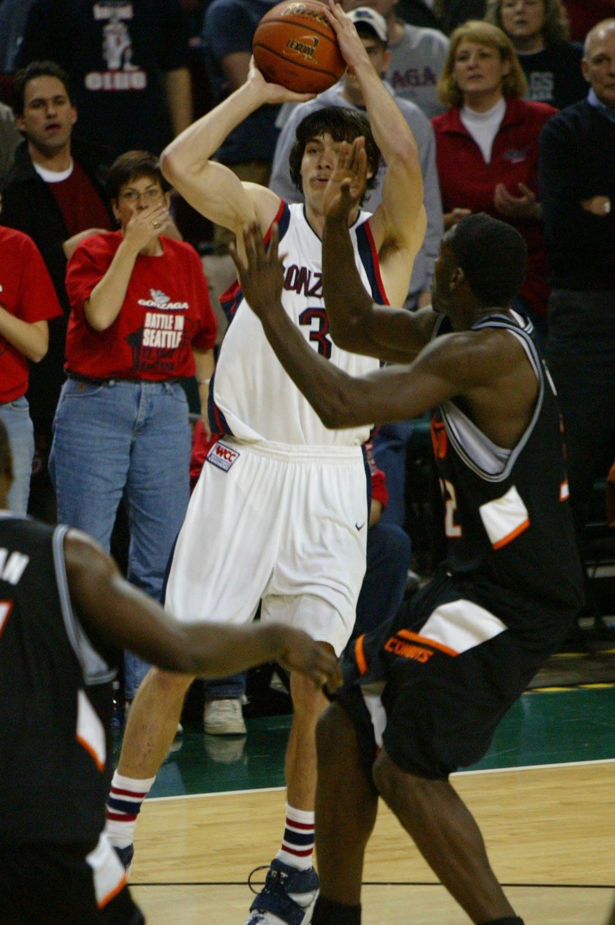 Gonzaga’s Adam Morrison shoots the winning basket with 2.5 seconds left on Dec. 10, 2005, as Oklahoma State’s David Monds defends. Gonzaga won 64-62.  (Associated Press)