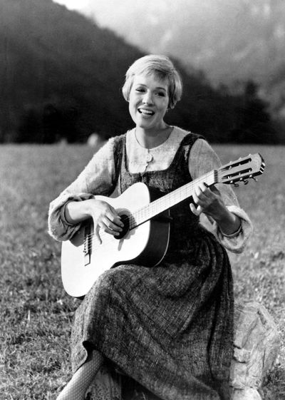 Julie Andrews brings music to the hills of Austria in this scene from “The Sound of Music,” the 1965 Oscar-winning film that airs tonight. (Associated Press)