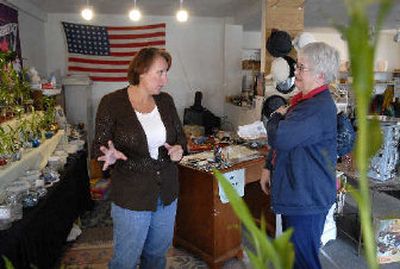 
U.S. Army Reserve Sgt. 1st Class and The Bamboo Lady store owner Terri Fowler, left, tells customer Karen Jassman that the shop in Spokane will be closing soon because Fowler has received  orders for deployment for eventual duty in Iraq.
 (Dan Pelle / The Spokesman-Review)