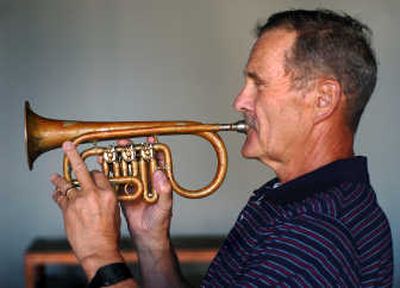 
Allen Gifford holds a cornet that belonged to his great-great grandfather, who played in a citizen brass band.
 (INGRID BARRENTINE/ / The Spokesman-Review)