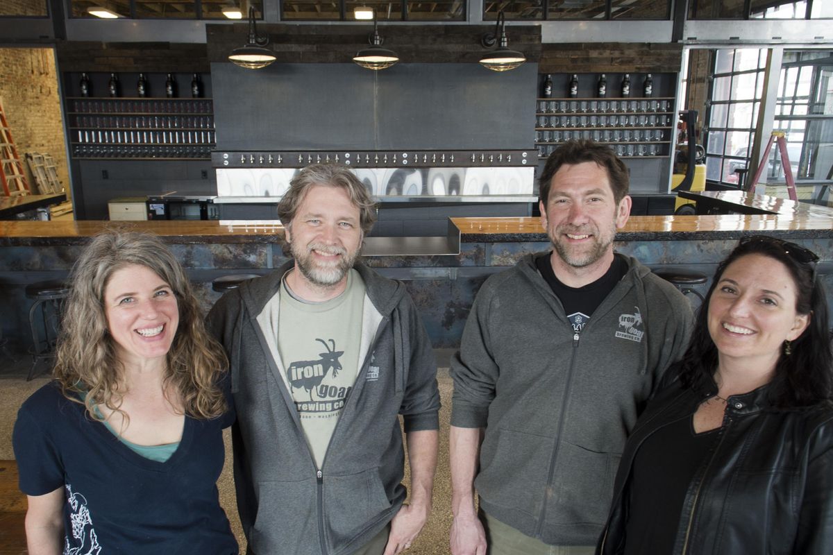 From left, Sheila Evans, Paul Edminster, Greg Brandt and Heather Brandt, owners of Iron Goat Brewery, are preparing to open their new location in downtown Spokane at 1302 W. Second Ave., shown Tuesday, April 5, 2016. The front of the house is almost complete and the brewery production facility in back is still under construction. (Jesse Tinsley / The Spokesman-Review)