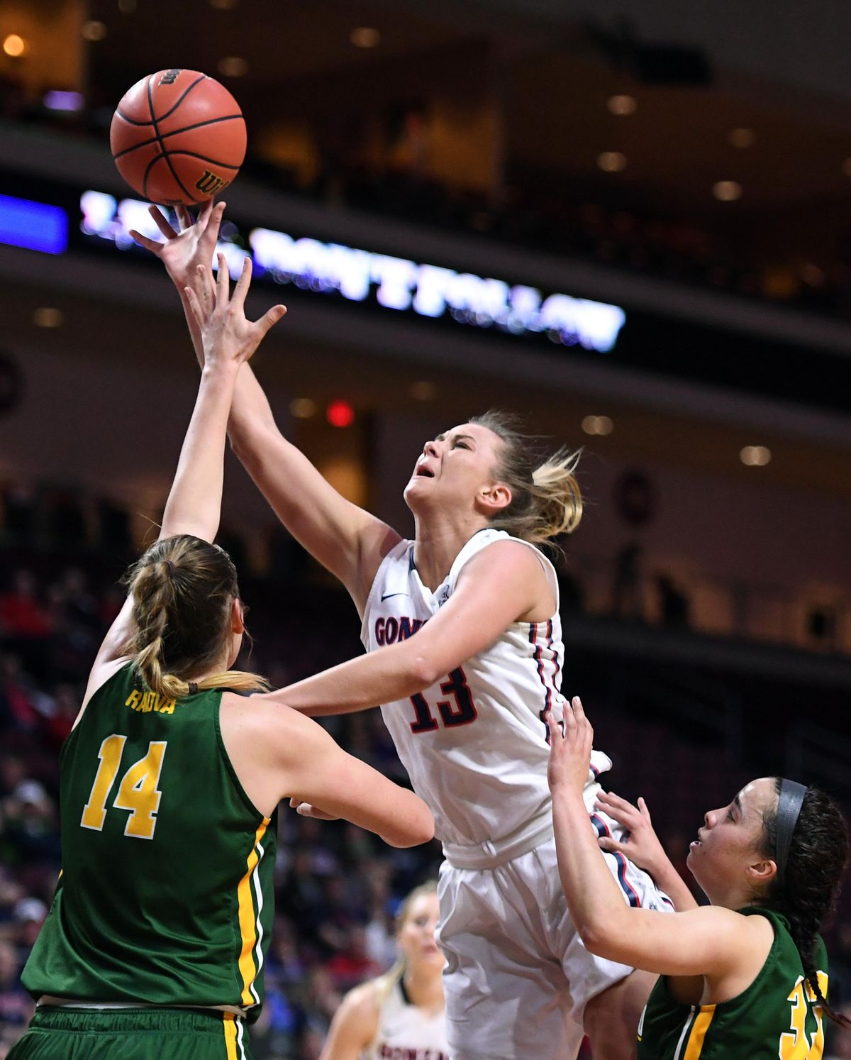 Gonzaga forward Jill Barta (13) takes a shot as San Francisco forward Michaela Rakova (14) defends during a West Coast Conference Basketball Championships women