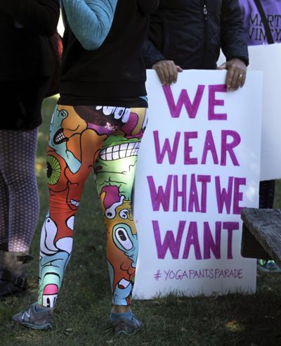 A woman joins others gathering at a starting point before marching in a “yoga pants parade” in Barrington, R.I., Sunday, Oct. 23, 2016. (Kris Craig / Associated Press)