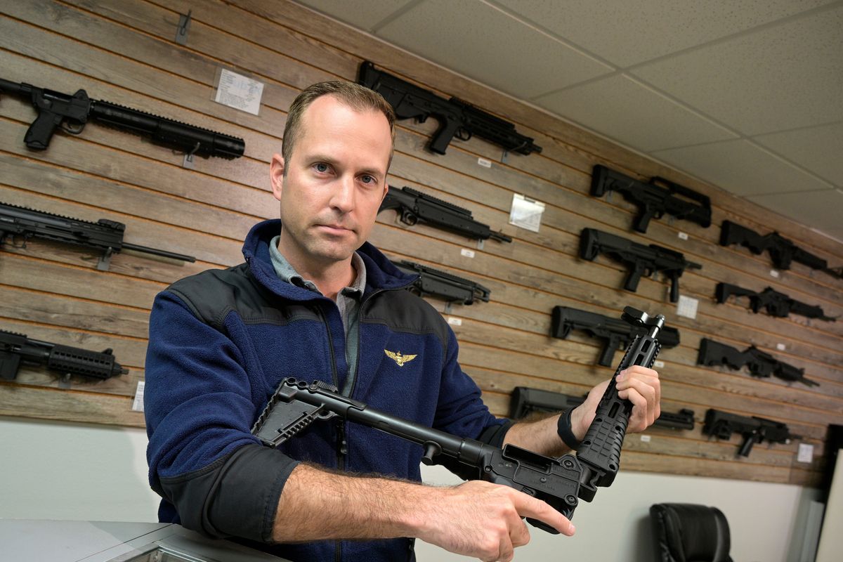 Adrian Kellgren, director of industrial production of KelTec, holds a 9mm SUB2000 rifle, similar to ones being shipped to Ukraine, on Thursday at their manufacturing facility in Cocoa, Fla. (Phelan M. Ebenhack)