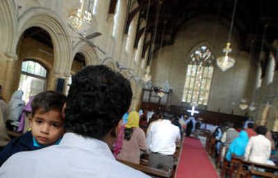 
A young child is held as people stand during a service St. Thomas Church in Karachi, Pakistan,  Jan. 6. Associated Press photos
 (Associated Press photos / The Spokesman-Review)