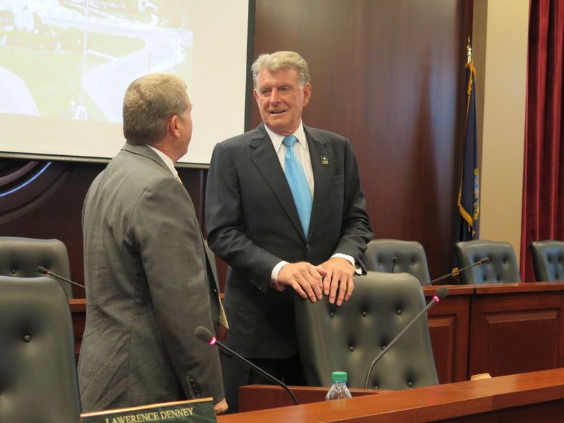 Idaho Gov. Butch Otter, right, visits with Attorney General Lawrence Wasden before the start of the state Land Board meeting on Tuesday, Aug. 15, 2017; Otter returned to the Statehouse this week after working from home while recovering from two back surgeries and an infection. (Betsy Z. Russell)