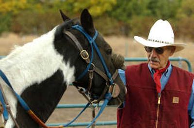 
Bob McMurray, who works with Panhandle Equine Rescue, works with a horse named Cheyenne at his ranch on the Rathdrum Prairie. 
 (Jesse Tinsley / The Spokesman-Review)