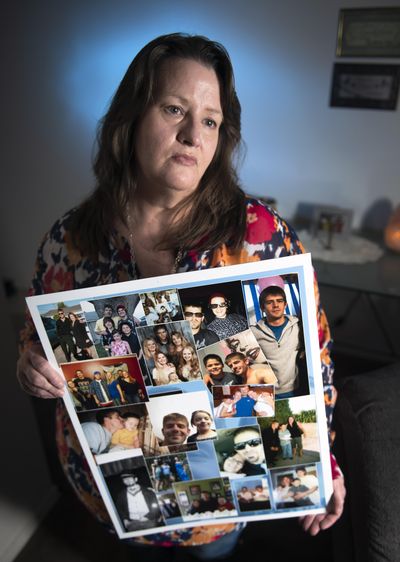 Diana Eschen holds a collage of photographs of her son Thomas Delafield, 34, who was killed by a gunshot to the head February 26, 2018. Witnesses said he was playing Russian Roulette. Eschen believes someone else is responsible. (Colin Mulvany / The Spokesman-Review)
