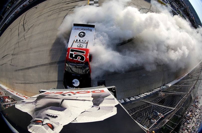 Kyle Busch, driver of the #51 ToyotaCare Toyota, celebrates with a burnout after winning the NASCAR Camping World Truck Series Lucas Oil 200 at Dover International Speedway on May 31, 2013 in Dover, Delaware. (Photo by Todd Warshaw/NASCAR via Getty Images)  (Todd Warshaw / Nascar)