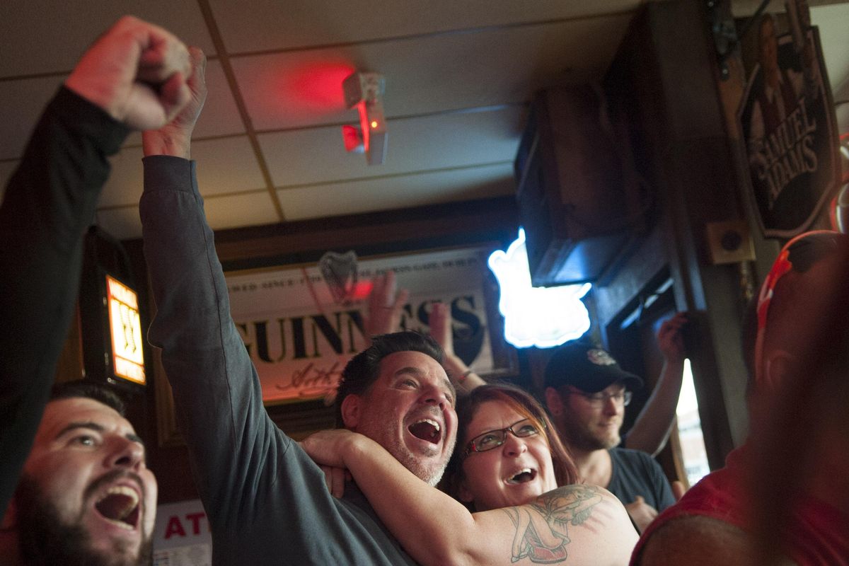 Zag fans Dean and Tracy Astleford react during the first half of the game against North Carolina at Jach and Dan's on Monday, April 3, 2017. (Kathy Plonka / The Spokesman-Review)