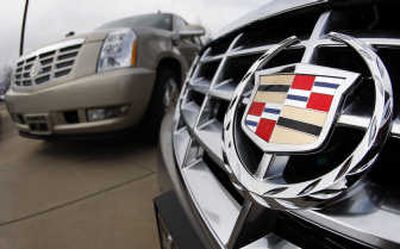 
The company crest shines off the grille of an unsold 2008 DTS sedan, front, while an unsold 2008 Escalade sits in the background at a Cadillac dealership in Boulder, Colo.Associated Press
 (Associated Press / The Spokesman-Review)