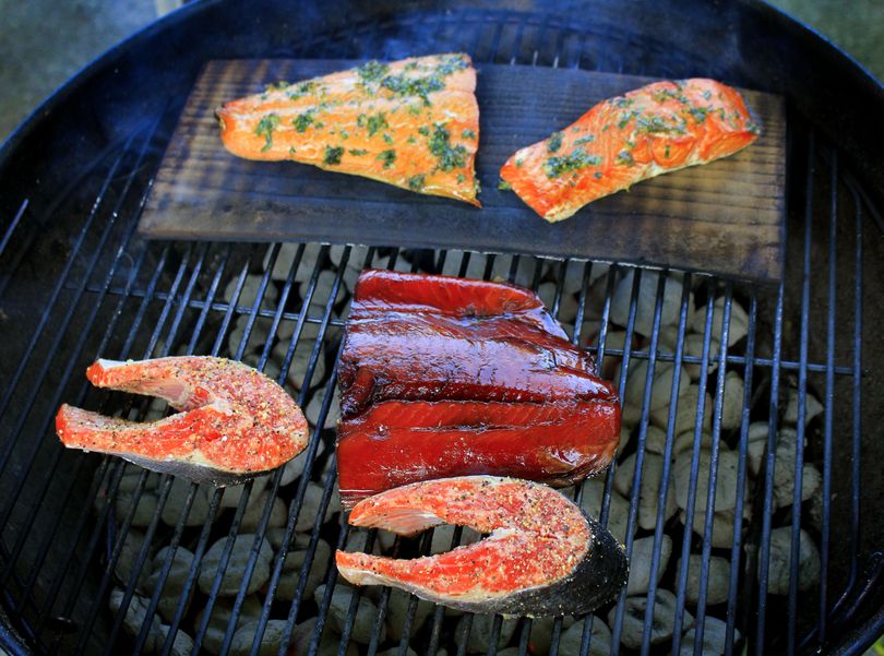 The Salmon Grill-Off in Jim Kershner’s Spokane backyard tests three recipes: grilled marinated salmon, grilled salmon with citrus butter and cedar-planked salmon. (Adriana Janovich)
