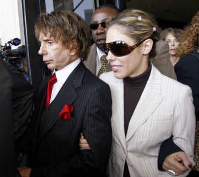 
Music producer Phil Spector and his wife, Rachelle, walk out of Los Angeles Superior Court after a mistrial was declared Wednesday.Associated Press
 (Associated Press / The Spokesman-Review)