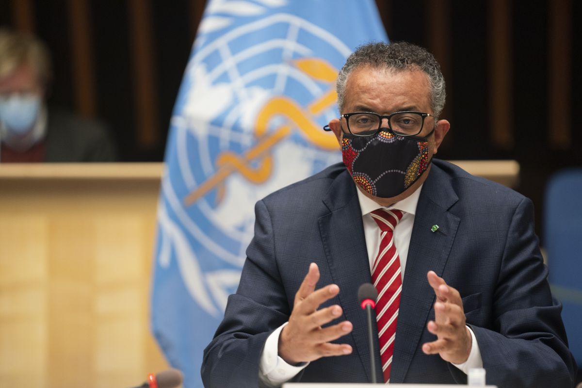 In this photo released by WHO, World Health Organisation on Monday, Oct. 5, 2020, WHO Director-General, Dr Tedros Adhanom Ghebreyesus, wearing a mask to protect against coronavirus, gestures during a special session on the COVID-19 respnse. The head of emergencies at the World Health Organization says its “best estimates” indicate that roughly 1 in 10 people worldwide may have been infected by the coronavirus.  (Christopher Black)
