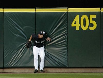 
Mariners center fielder Jeremy Reed reacts after catching a sacrifice fly hit by Detroit's Ivan Rodriguez in the fourth inning.
 (Associated Press / The Spokesman-Review)