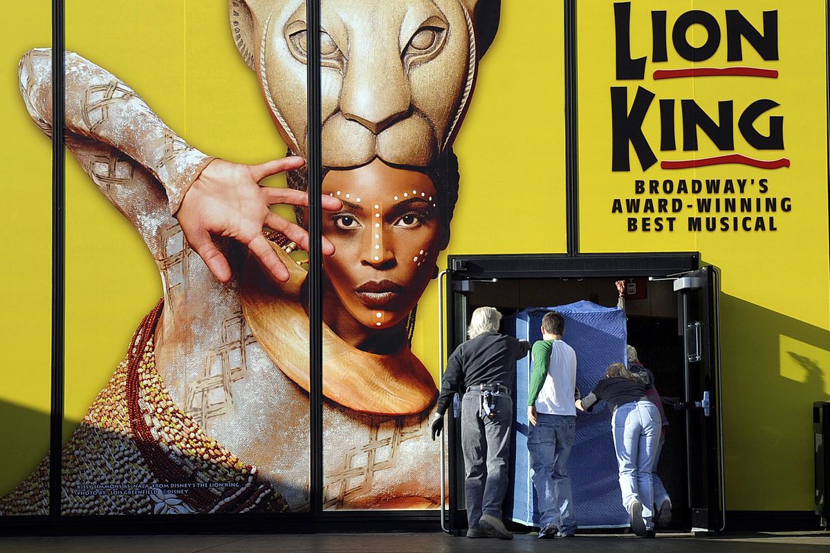 Props and merchandise are unloaded into the INB Performing Arts Center Tuesday in preparation for the run of “The Lion King” which begins today.  (Christopher Anderson / The Spokesman-Review)