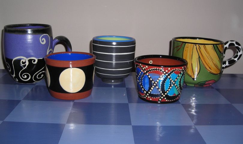 Every year I buy a new coffee mug at ArtFest (yes, I have a problem, I know). This is a sampling of some of the mugs I've found from vendors in Coeur d'Alene Park. I love them! (Maggie Bullock)