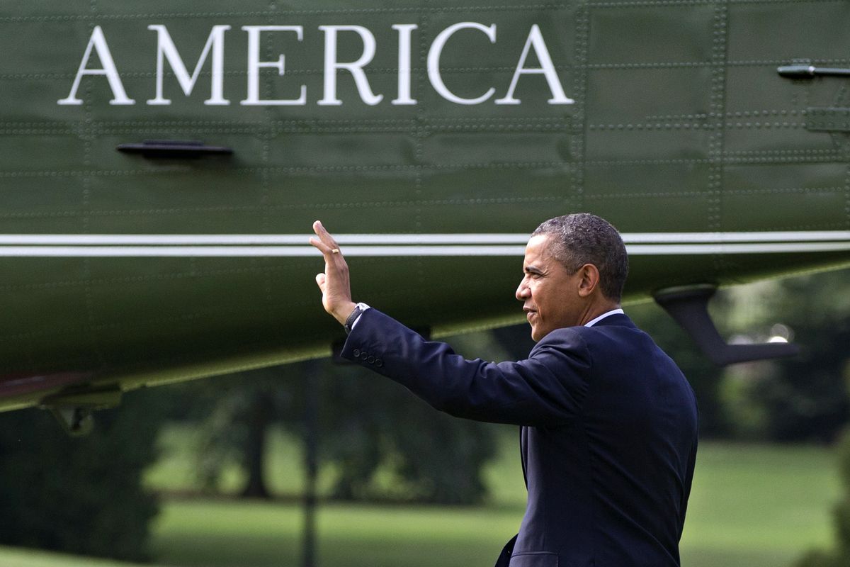 President Barack Obama walks to the Marine One helicopter at the White House on Friday. (Associated Press)