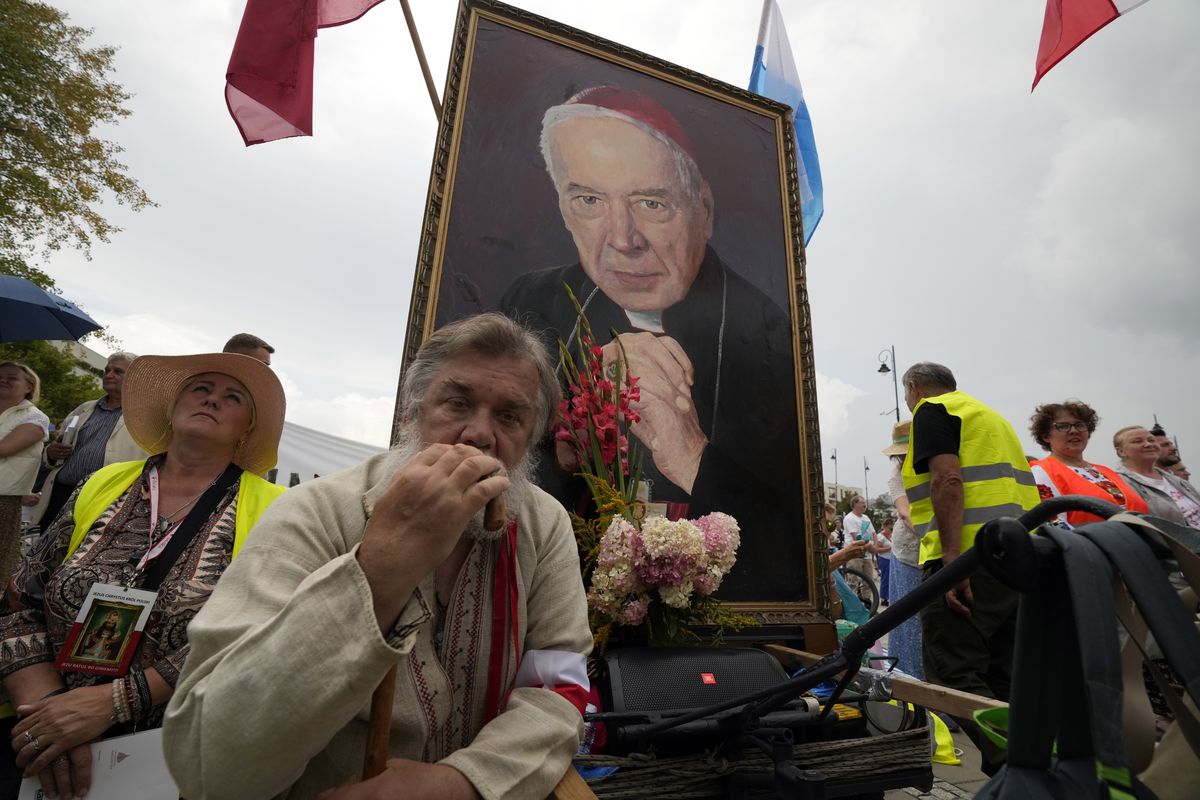 Catholic faithful attend the beatification ceremony of Polish Cardinal Stefan Wyszynski and Mother Elzbieta Roza Czacka in front of the church of Providence in Warsaw, Poland, Sunday, Sept. 12, 2021. Poland