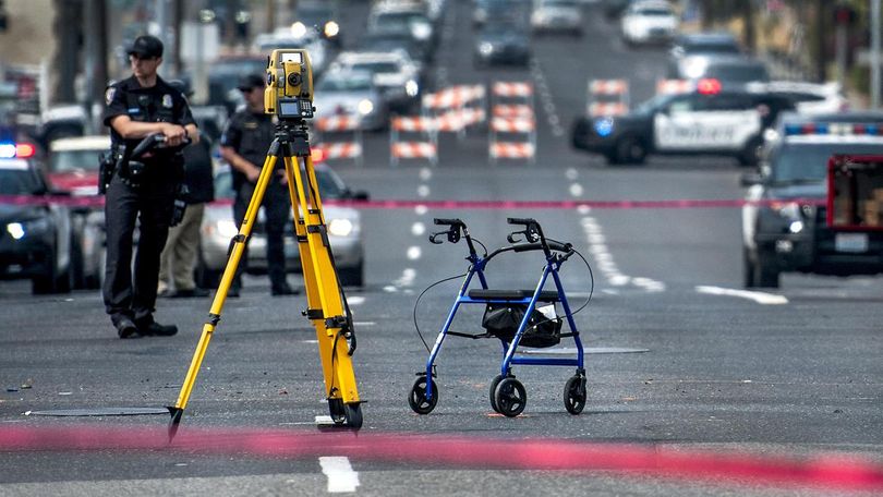 The pedestrian using this walker was struck and killed near a crosswalk in Division Street at Third Avenue just after 10 a.m. in Spokane on Monday morning. (Kathy Plonka / The Spokesman-Review)