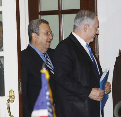 Israeli Prime Minister Benjamin Netanyahu, right, with Deputy Prime Minister and Minister of Defense Ehud Barak, leave the White House’s West Wing Tuesday.  (Associated Press)