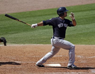New York Yankees’ Mike Ford hits a double against the Philadelphia Phillies in the sixth inning of a spring training game this past March in Clearwater, Fla. (John Raoux / Associated Press)