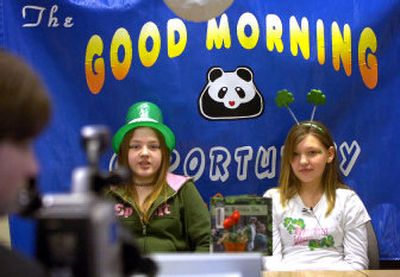 
 Anchors Jessica Demchuk, left, and Ally Daly present the week's news in a live show  seen in all classrooms at Opportunity Elementary School on Friday morning. A group of fifth-grade students produces a show full of announcements and reporting. 
 (Holly Pickett / The Spokesman-Review)