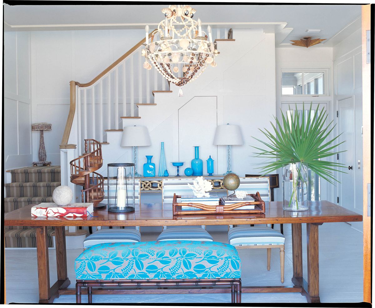 Blues can be especially cooling, says Suzanne Kasler, an interior designer and author. With a collection of vintage blue accessories and blue printed fabrics, Kasler creates a soothing, cool atmosphere in an entryway that doubles for dining. Rizzoli USA (Rizzoli USA)