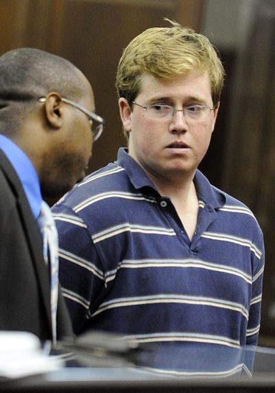 Michael Enright, right, confers with his attorney, Jason Martin, during his arraignment in a New York City courtroom  Wednesday.  (Associated Press)