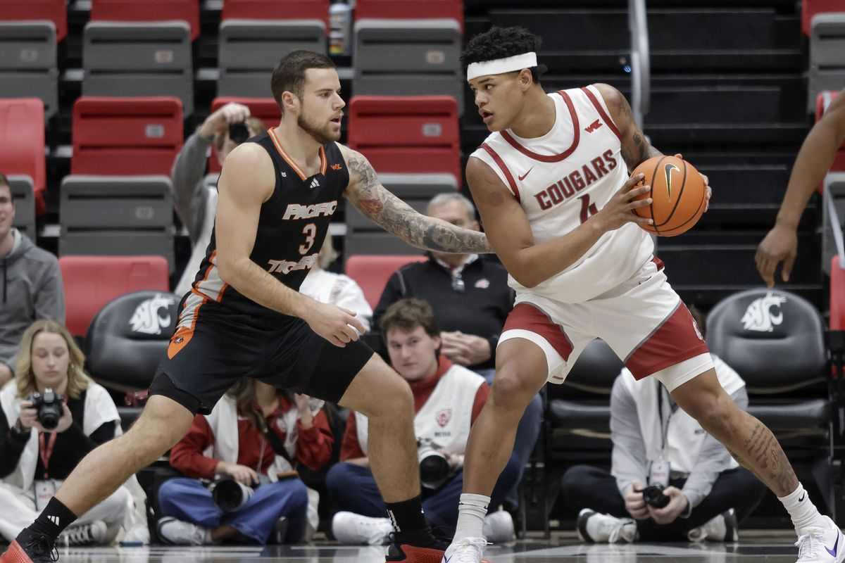 Pacific guard Petar Krivokapic (left) puts pressure on Washington State forward LeJuan Watts in the first half on Thursday, Jan. 9, 2025, at Beasley Coliseum in Pullman, Wash.  (Geoff Crimmins/For The Spokesman-Review)