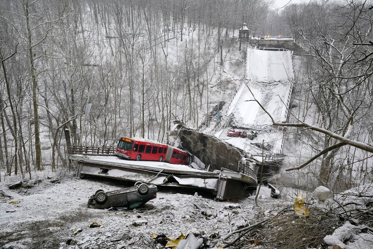 A Port Authority bus that was on a bridge when it collapsed Friday Jan. 28, 2022, is visible in Pittsburgh