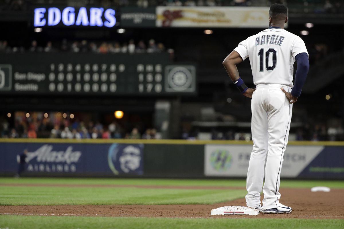 Seattle’s Cameron Maybin stands on first base after he flew out with two outs and the bases loaded to end the eighth inning against the San Diego Padres on Tuesday in Seattle. (Ted S. Warren / AP)