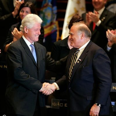 Former U. S. President Bill Clinton is greeted by Pennsylvania Gov. Ed Rendell, right, before Clinton addresses the National Governors Association during their centennial meeting Saturday.Associated Press (Associated Press / The Spokesman-Review)