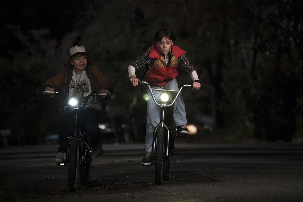 Gaten Matarazzo and Noah Schnapp in a “Stranger Things” scene that gives a nod to another classic – “E.T.: the Extra-Terrestrial.”  (Curtis Baker/Netflix)